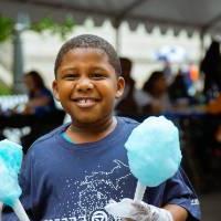 Boy with Laker Effect shirt on holding cotton candy